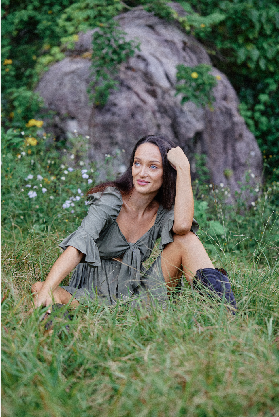 Khaki green mini empire waist dress with a bow tie enclosure in the front. Elastic bust and sleeves for a forgiving fit. Can be worn off the shoulder or backwards. Is breastfeeding and bust friendly.